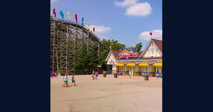 Holiday World entrance beside a wooden roller coaster