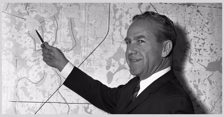 Disney Legend Joe Potter points to a map during Walt Disney World planning