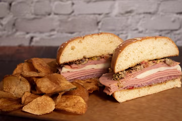 A sandwich and kettle fries pictured on Kings Island’s French Corner dining page