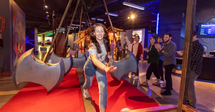 Guests play an axe-dodging game inside Level99 at Disney Springs