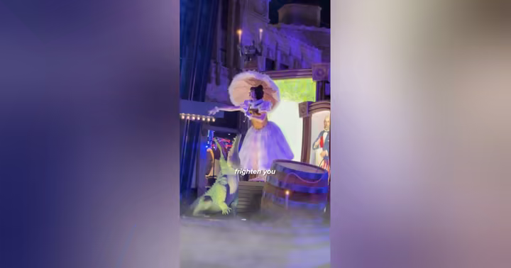 A ghostly dancer performs at Madame Leota's Swinging Wake