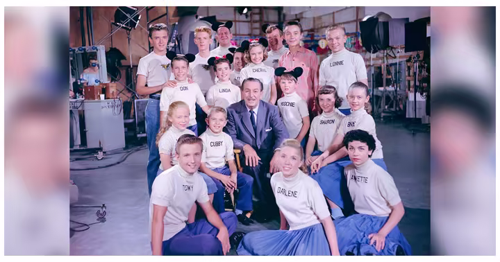 Walt Disney poses with the original Mickey Mouse Club cast