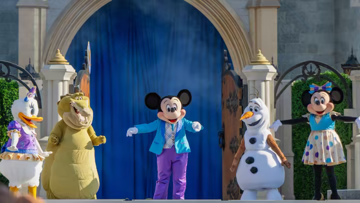 Mickey Mouse and friends perform Mickey's Magical Friendship Faire on the Cinderella Castle Forecourt Stage at Magic Kingdom