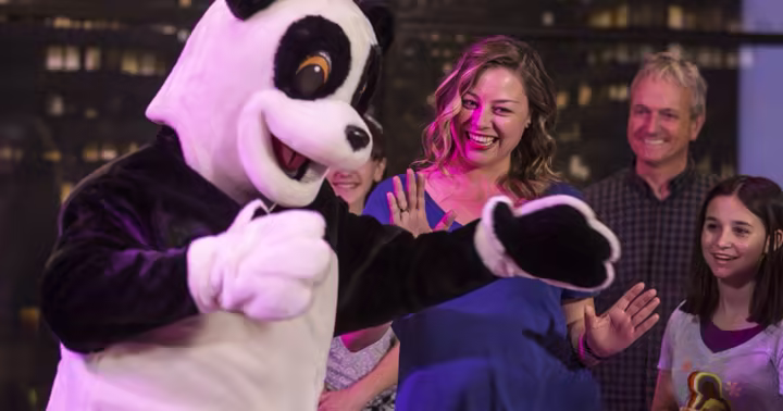 Hashtag the Panda greets guests inside Race Through New York Starring Jimmy Fallon