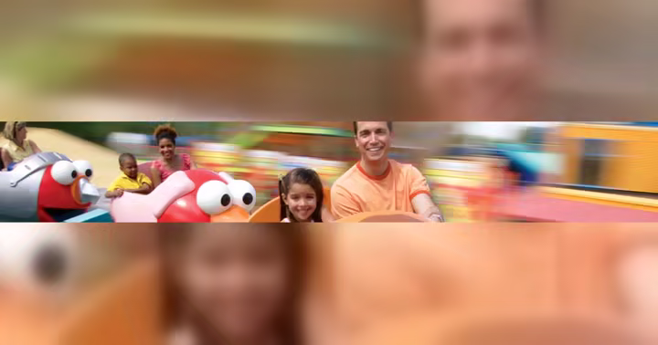 Families ride a colorful Sesame Place attraction