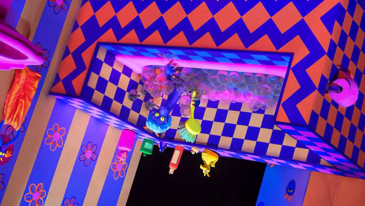 Figment in the upside-down bath scene on Journey Into Imagination With Figment at EPCOT.