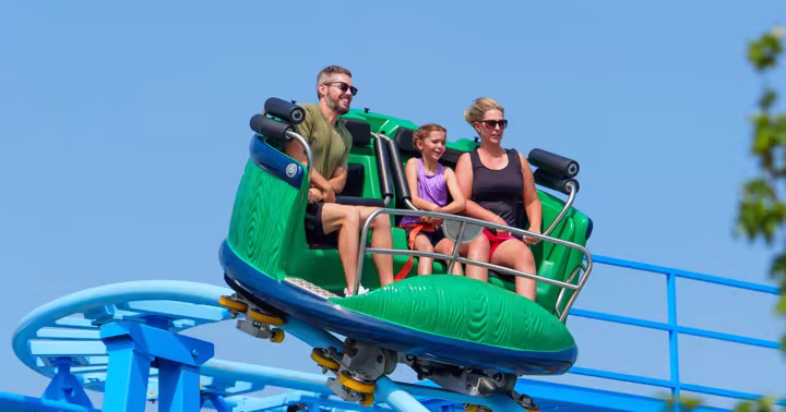 A family rides a spinning coaster during Six Flags Great Adventure's Day of Giving