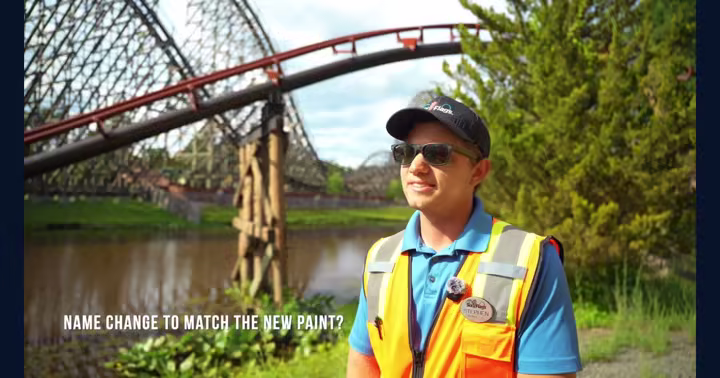 Runaway Mine Train track and a Six Flags Great Adventure team member in an official repaint video still