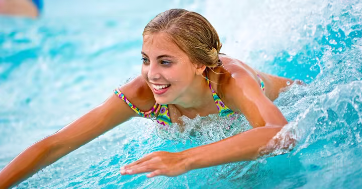 Children and instructors in a pool during a World's Largest Swimming Lesson event