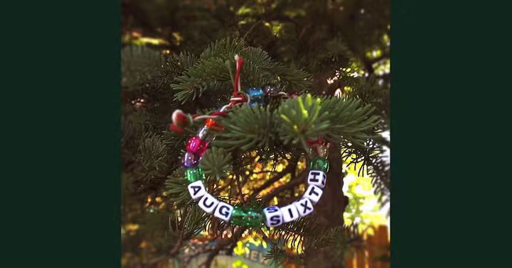 A bracelet in a tree spells Aug Six in Six Flags Great America's teaser