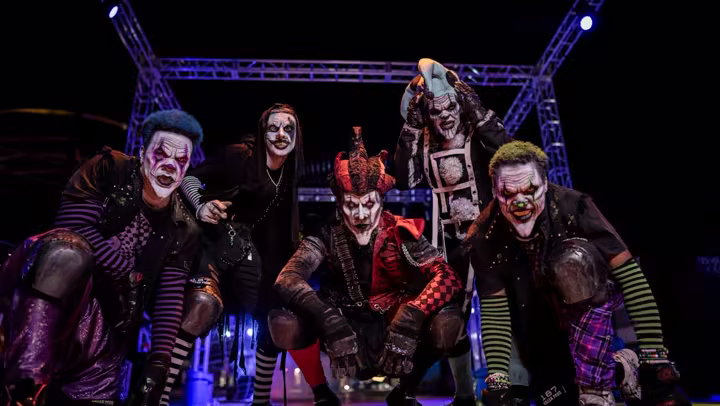 Fright Fest performers in makeup under stage lights at Six Flags Magic Mountain