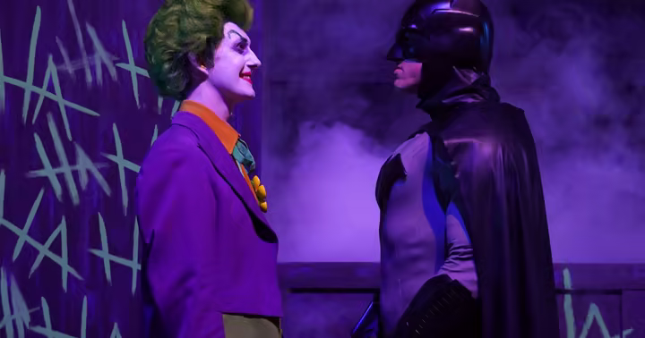 Batman and The Joker face each other during DC Heroes and Villains Fest