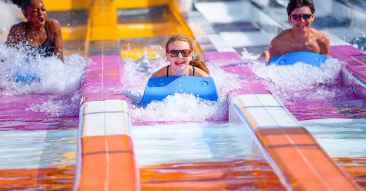 Guests ride a water slide at Six Flags White Water