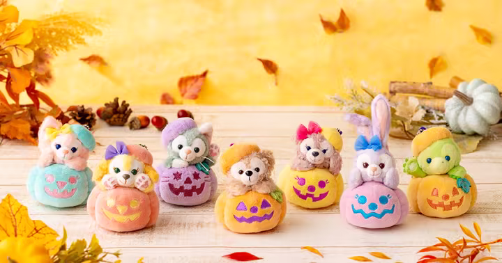 Duffy and Friends plush characters sitting in colorful Halloween pumpkins