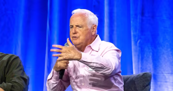 Tom Fitzgerald speaking onstage at a Disney event