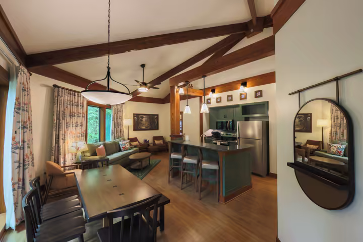 Living, dining, and kitchen area inside a refreshed Treehouse Villa at Disney's Saratoga Springs Resort & Spa