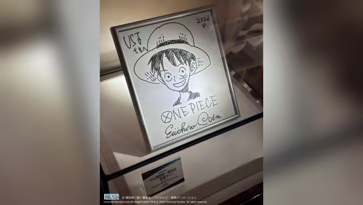 Eiichiro Oda’s framed Luffy illustration and autograph on display at Universal Studios Japan