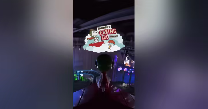Snoopy's Flying Ace Adventure title over the ride POV at Universal Studios Japan