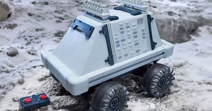 White Polar Mouse Droid with remote control on snowy ground