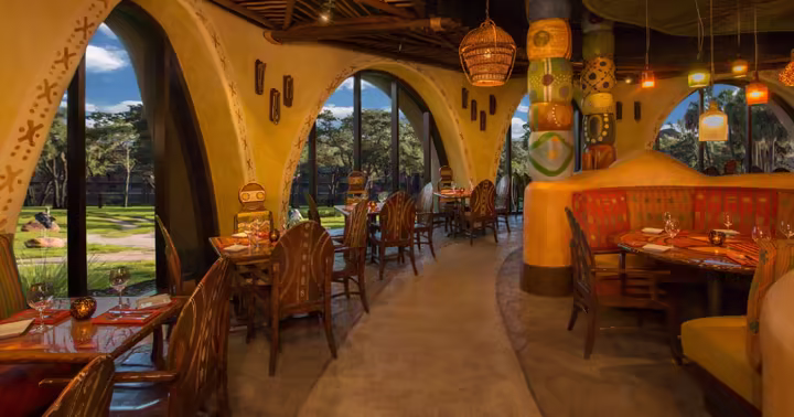 Dining room at Sanaa with windows looking toward the savanna at Disney's Animal Kingdom Lodge