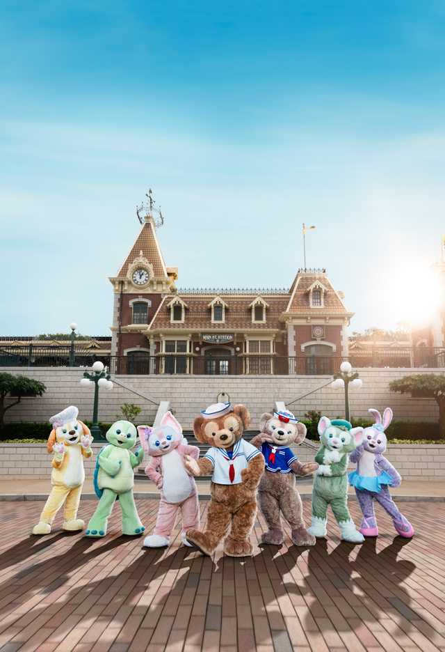 Duffy and Friends stand outside the Hong Kong Disneyland train station