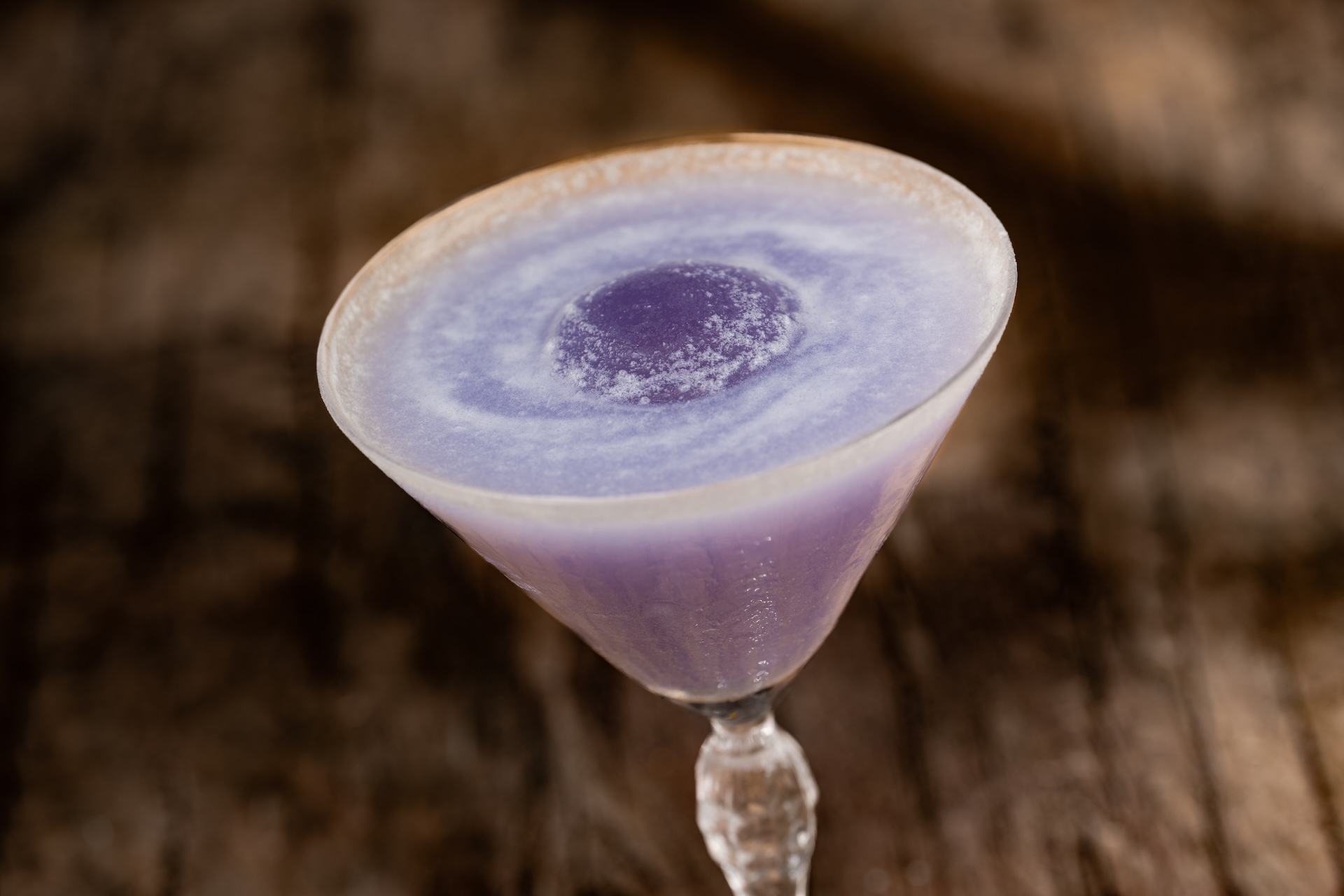 Purple Midnight Relic cocktail with edible glitter