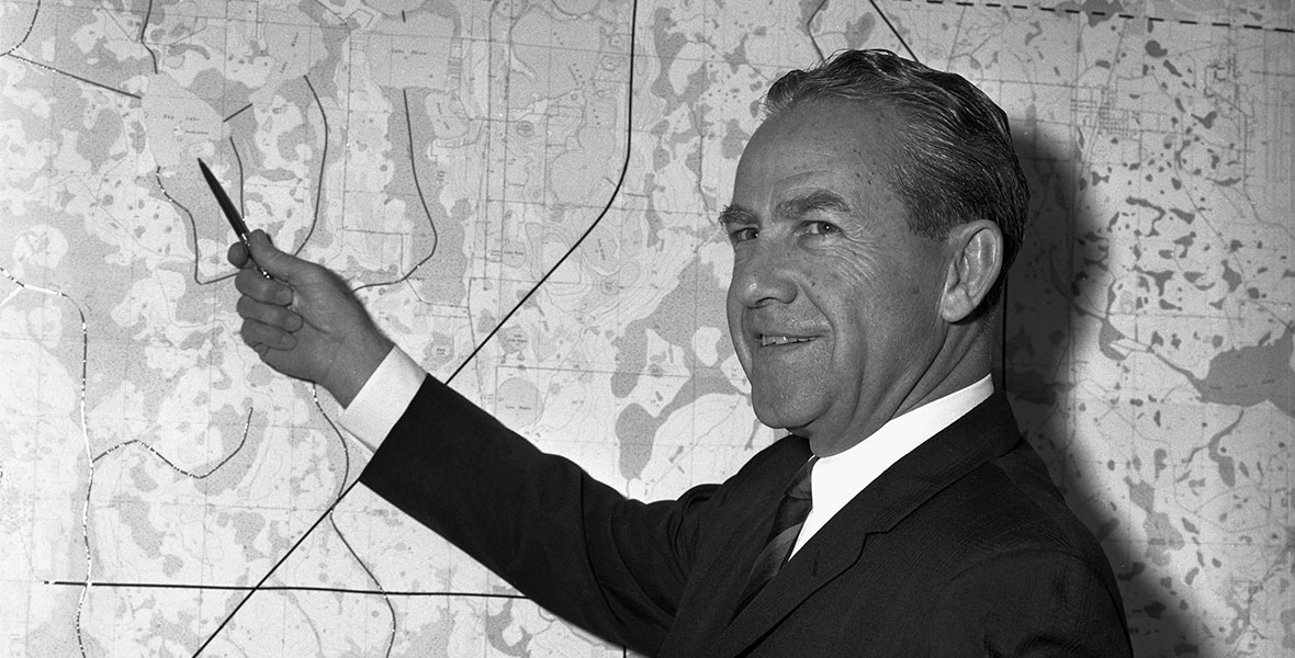 Disney Legend Joe Potter points to a map during Walt Disney World planning