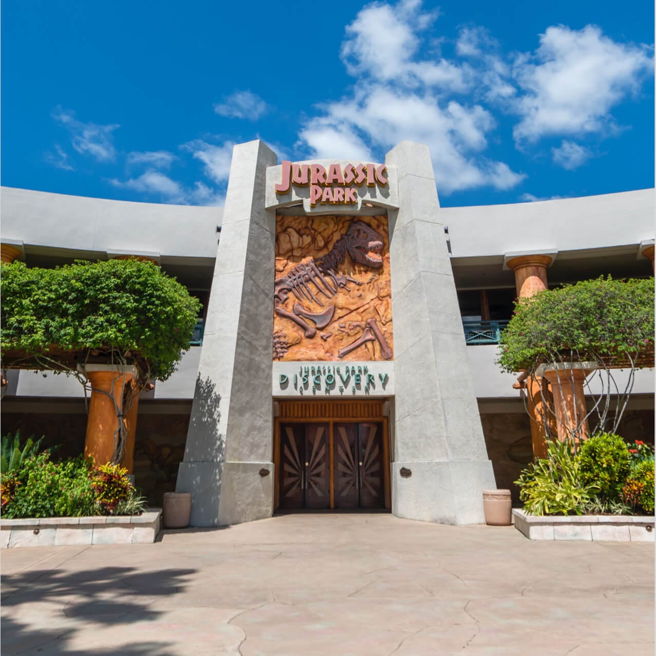 Palm-lined rear entrance to Jurassic Park Discovery Center at Universal Islands of Adventure