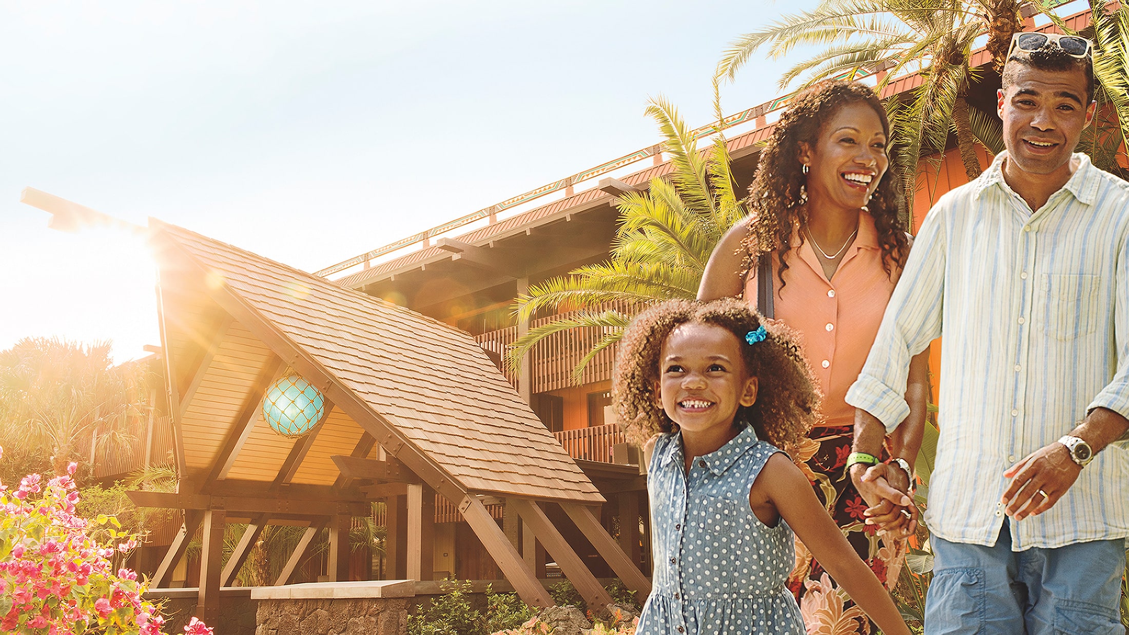 A family outside a Disney Vacation Club resort building at Walt Disney World