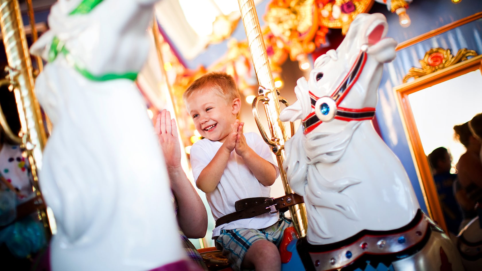 A child rides King Arthur Carrousel in Fantasyland at Disneyland Park