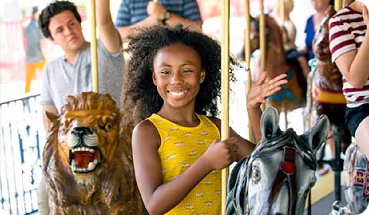 Guests ride a carousel at Knott's Berry Farm