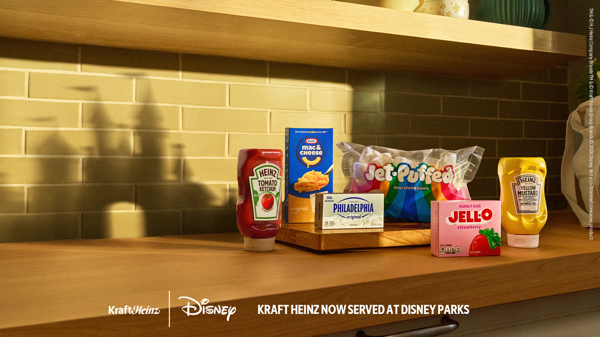 Kraft Heinz products arranged beneath a Mickey Mouse shadow with Disney and Kraft Heinz logos