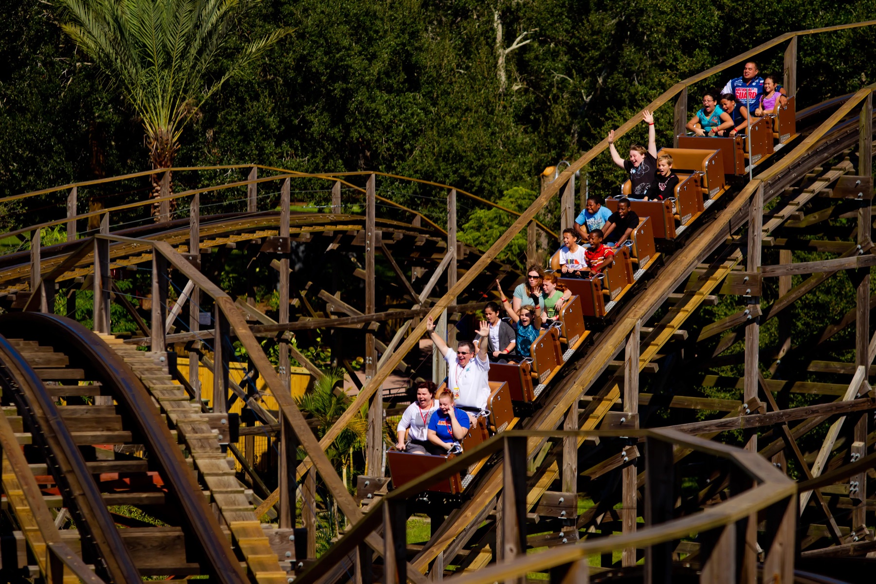 The Coastersaurus train traveling over its wooden track at LEGOLAND Florida Resort