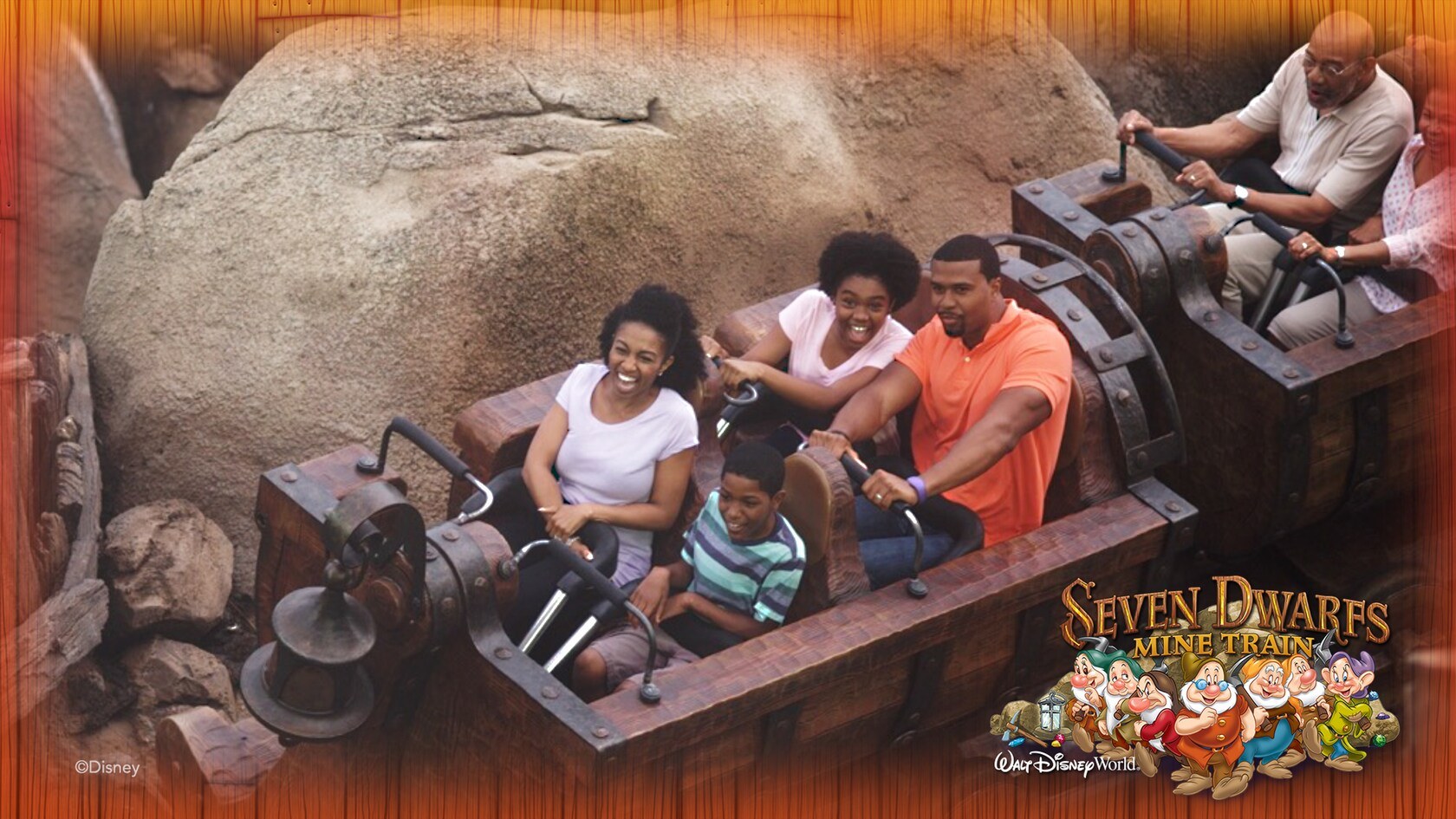 Guests riding Seven Dwarfs Mine Train at Magic Kingdom