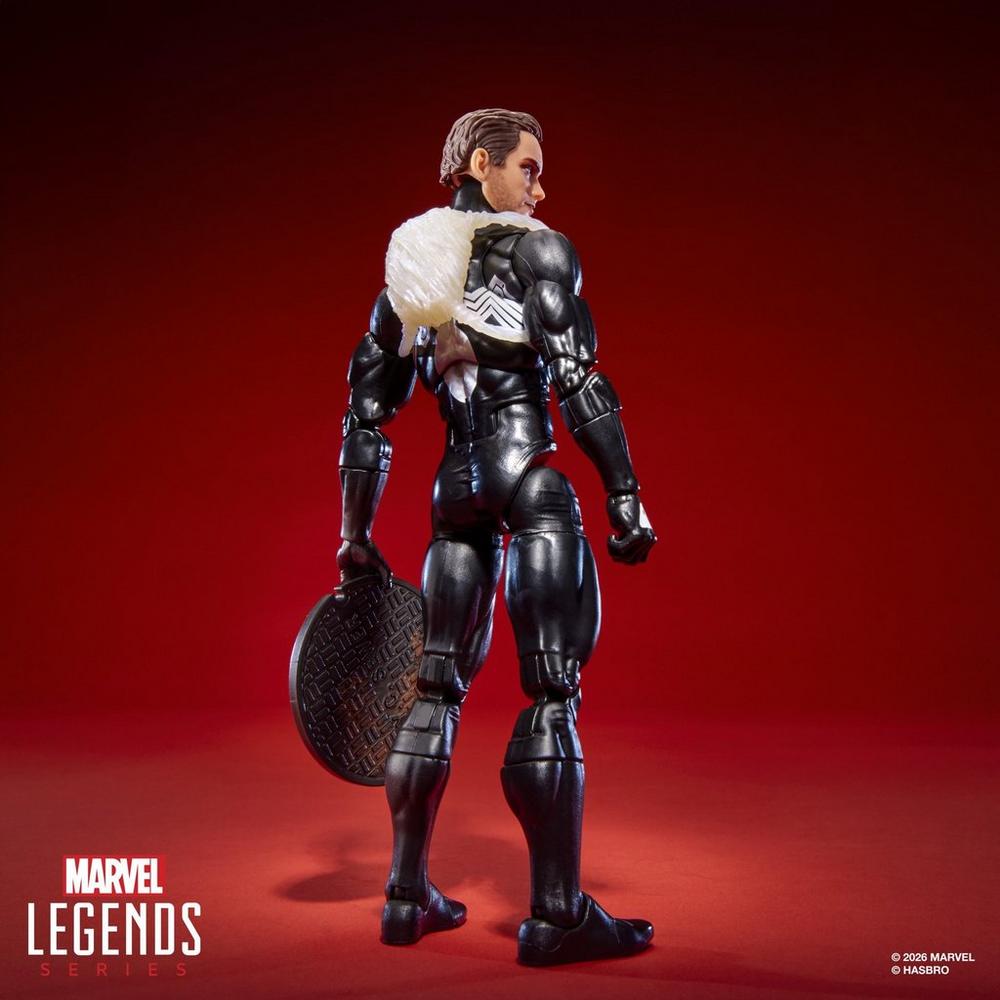 Unmasked Peter Parker figure wearing the backpack and holding the manhole cover