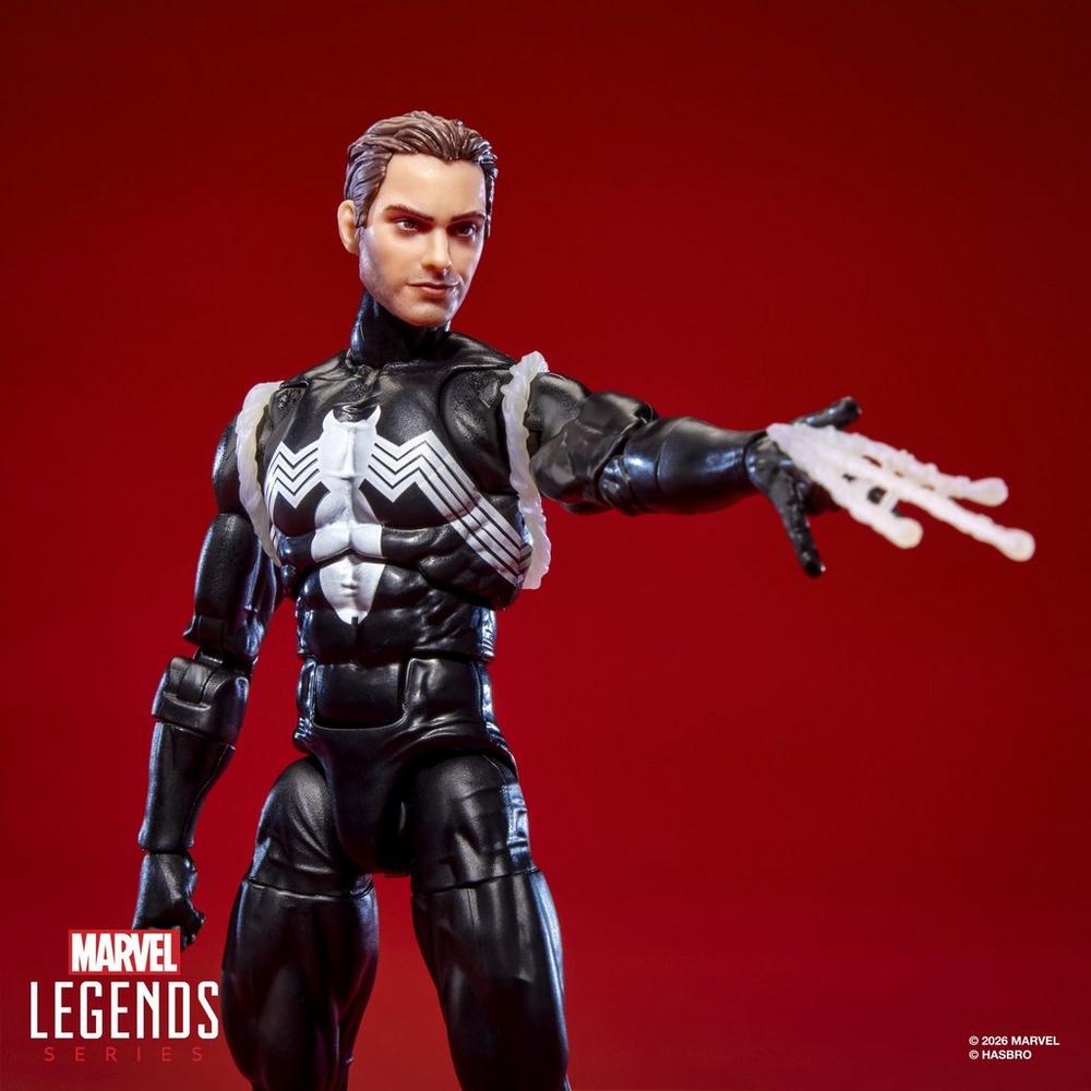Unmasked Peter Parker figure firing a web effect