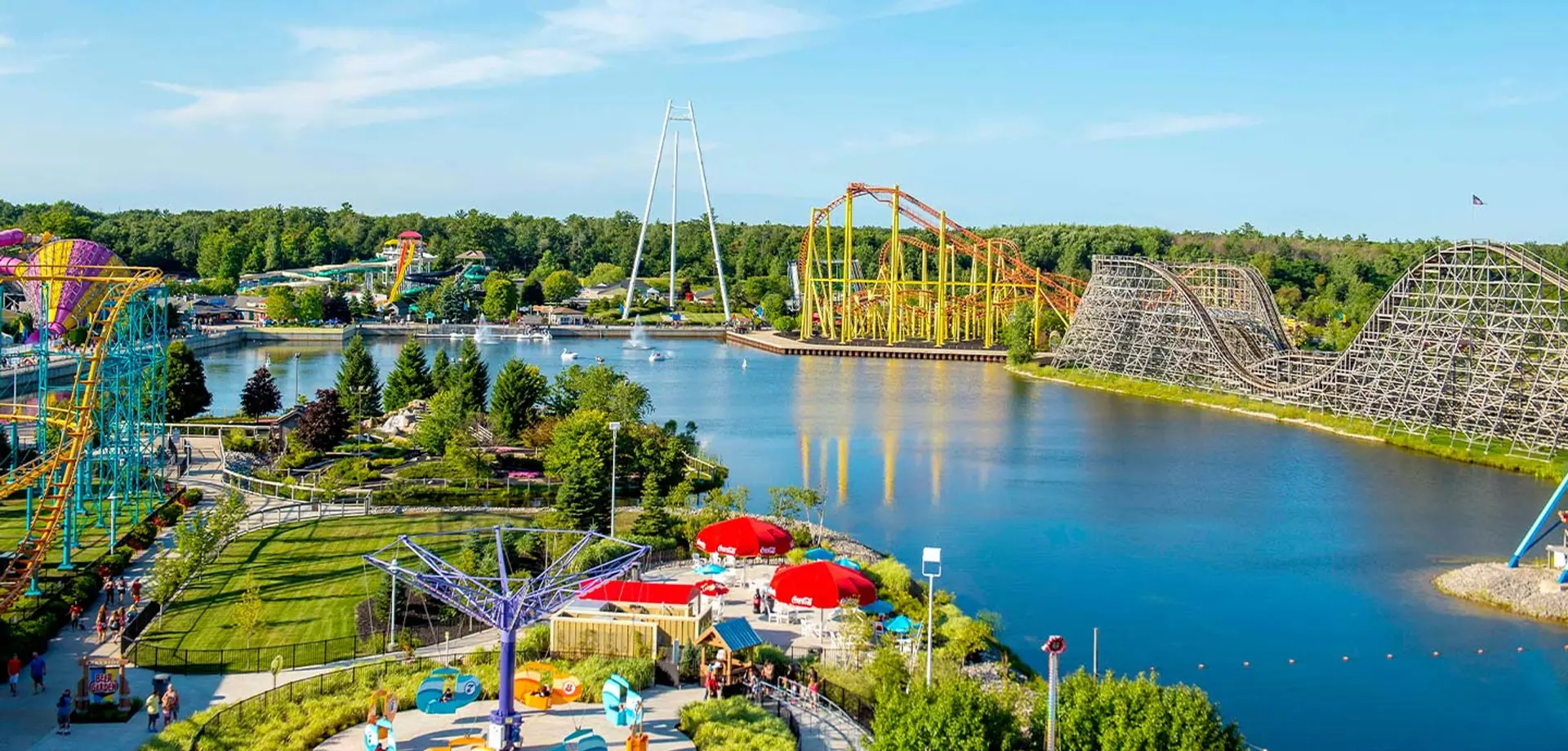 Aerial view of Michigan's Adventure with roller coasters and a lake