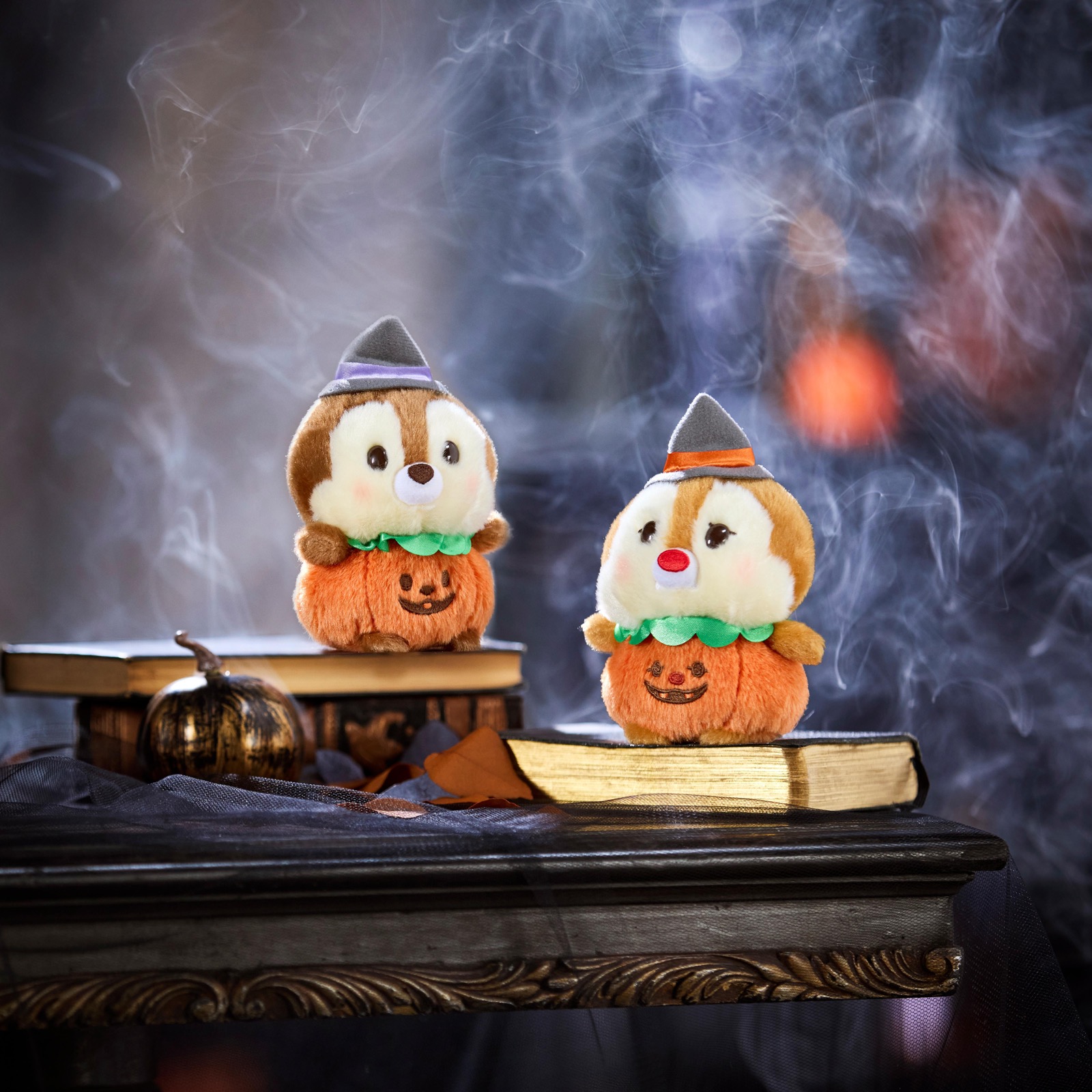Chip and Dale plush wearing pumpkin costumes and witch hats