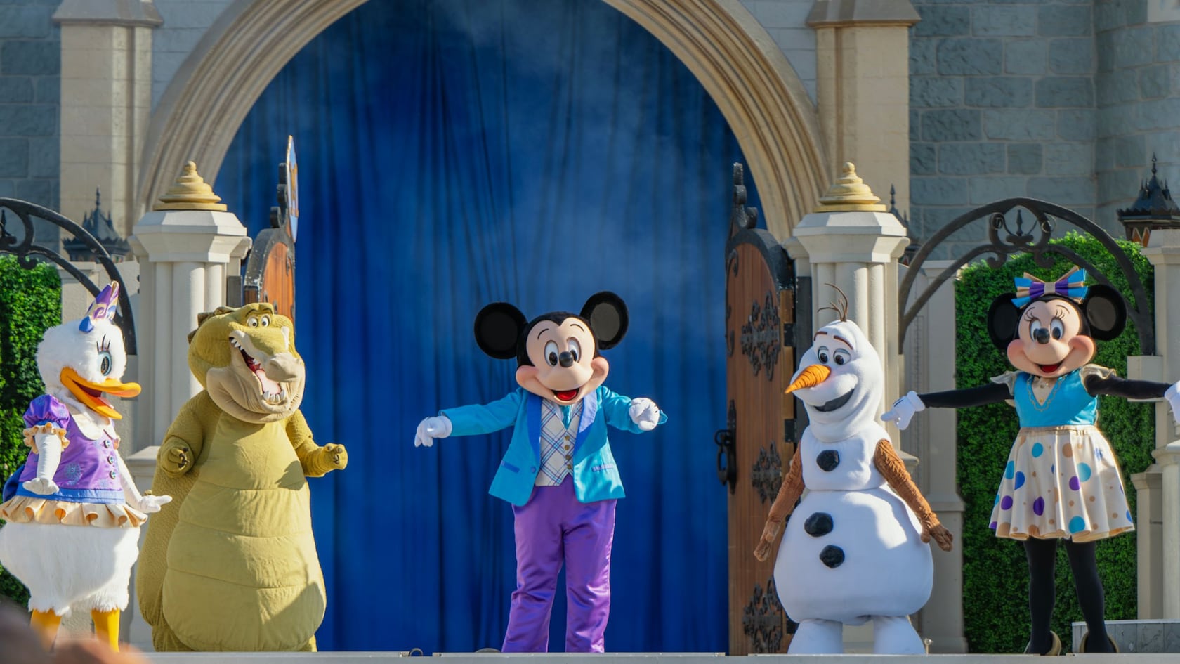 Mickey Mouse and friends perform Mickey's Magical Friendship Faire on the Cinderella Castle Forecourt Stage at Magic Kingdom
