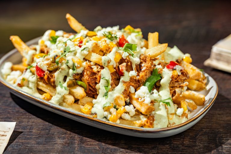 Chipotle Barbecue Pork and Street Corn French Fries: French fries topped with fire-roasted corn, queso fresco, jalapeño ranch, and cilantro (Available during Mickey’s Not-So-Scary Halloween Party only)