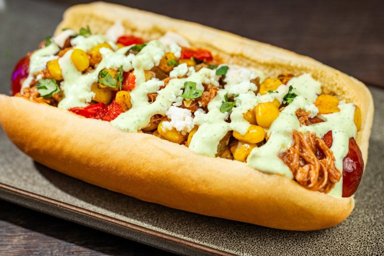 Chipotle Barbecue Pork and Street Corn Hot Dog: All-beef hot dog topped with fire-roasted corn, queso fresco, jalapeño ranch, and cilantro (Available during Mickey’s Not-So-Scary Halloween Party only)