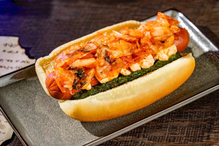 Creepy Kimchi Hot Dog topped with sriracha cream cheese, kimchi, and Hades relish (Available during Mickey’s Not-So-Scary Halloween Party only)