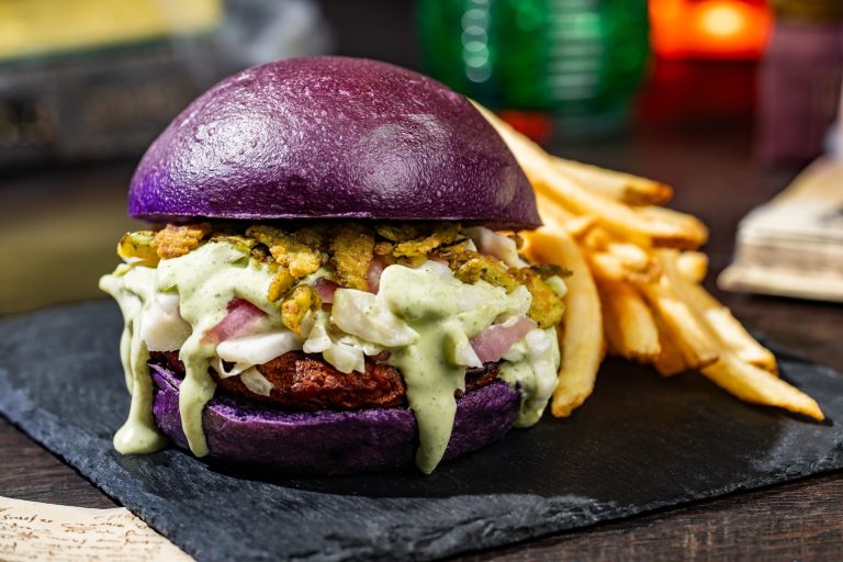 Frightful Black Bean Burger topped with jalapeño-ranch slaw and jalapeño chips served with french fries (Plant-based) (New) (Available during Mickey’s Not-So-Scary Halloween Party only)