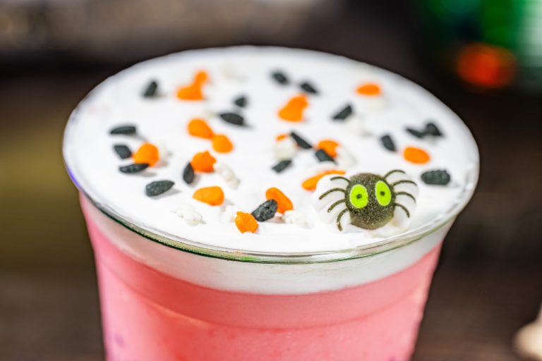 Guava Lemonade Slushy with cheesecake foam, Halloween sprinkles, and a sugar spider (Non-alcoholic) (Available during Mickey’s Not-So-Scary Halloween Party only)