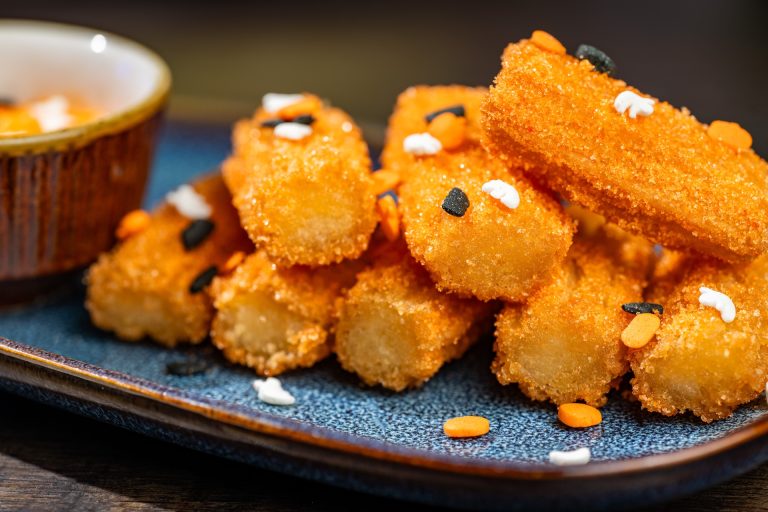 Pumpkin Patch Mini Churros rolled in orange sugar and served with pumpkin cheesecake dip (Available during Mickey’s Not-So-Scary Halloween Party only)
