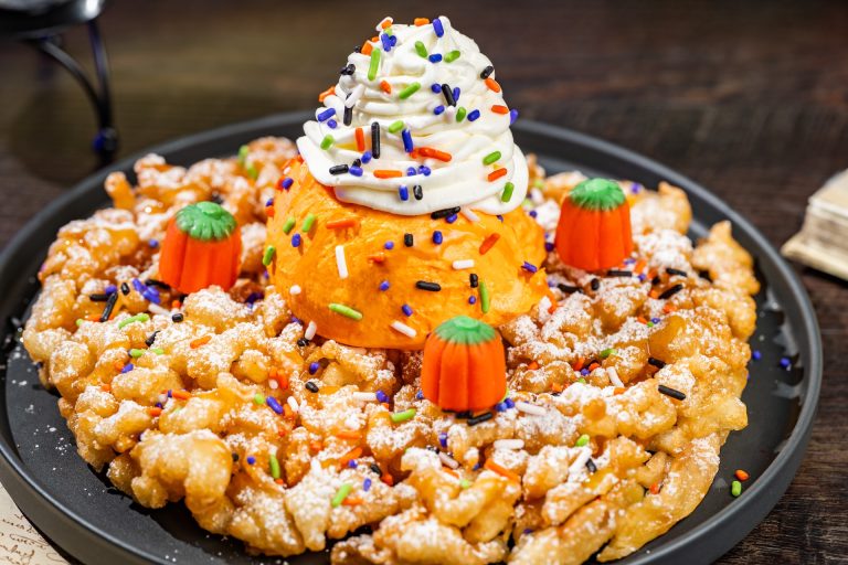 Pumpkin-spiced Funnel Cake Sundae: Pumpkin funnel cake topped with pumpkin gelato, whipped cream, pumpkin-spiced caramel, candy pumpkins, and sprinkles (Available during Mickey’s Not-So-Scary Halloween Party only)