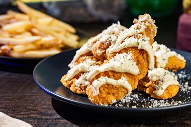 Undead Garlic-Parmesan Chicken Strips with garlic-Parmesan sauce, parsley, and served with french fries (Available during Mickey’s Not-So-Scary Halloween Party only)