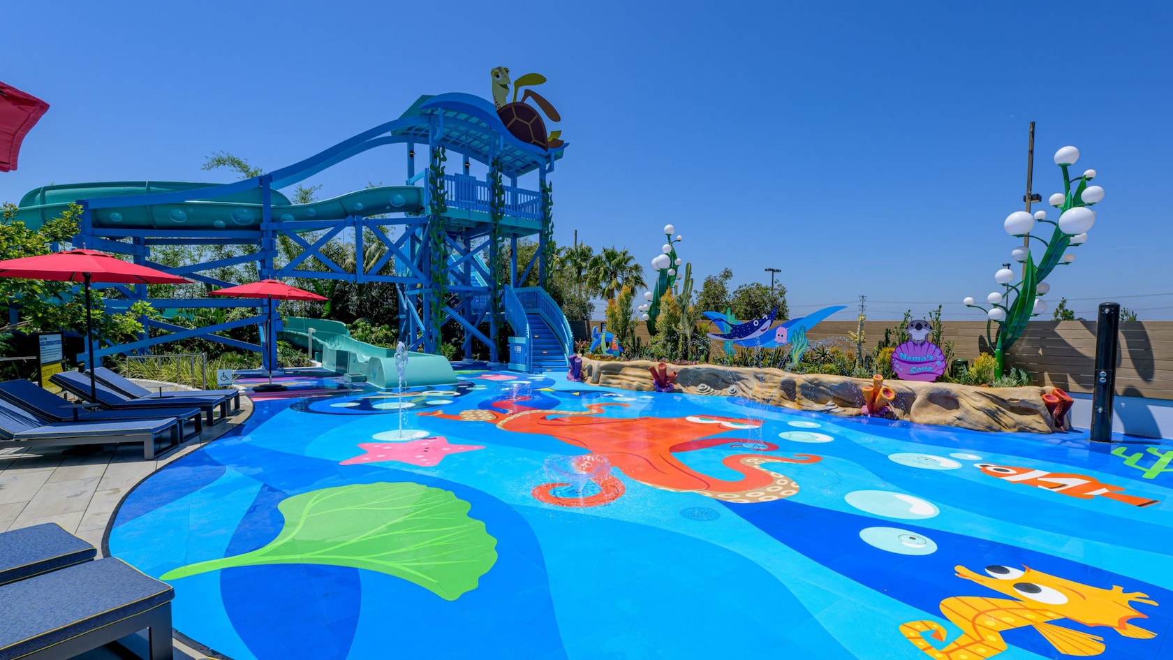File photo of Crush’s Surfin’ Slide and the Nemo-themed splash pad at Pixar Place Hotel.
