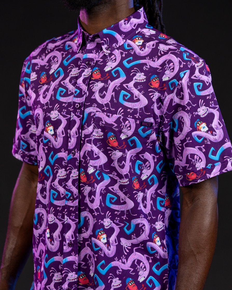 Purple Slithering Sabotage shirt covered with Randall and Mr. Waternoose from Monsters, Inc.