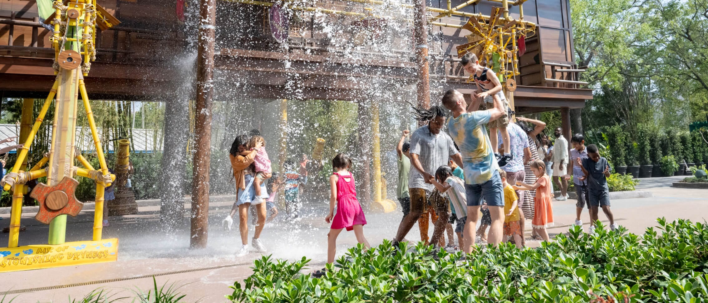 Families play under water features at Po's Kung Fu Training Camp in DreamWorks Land at Universal Studios Florida